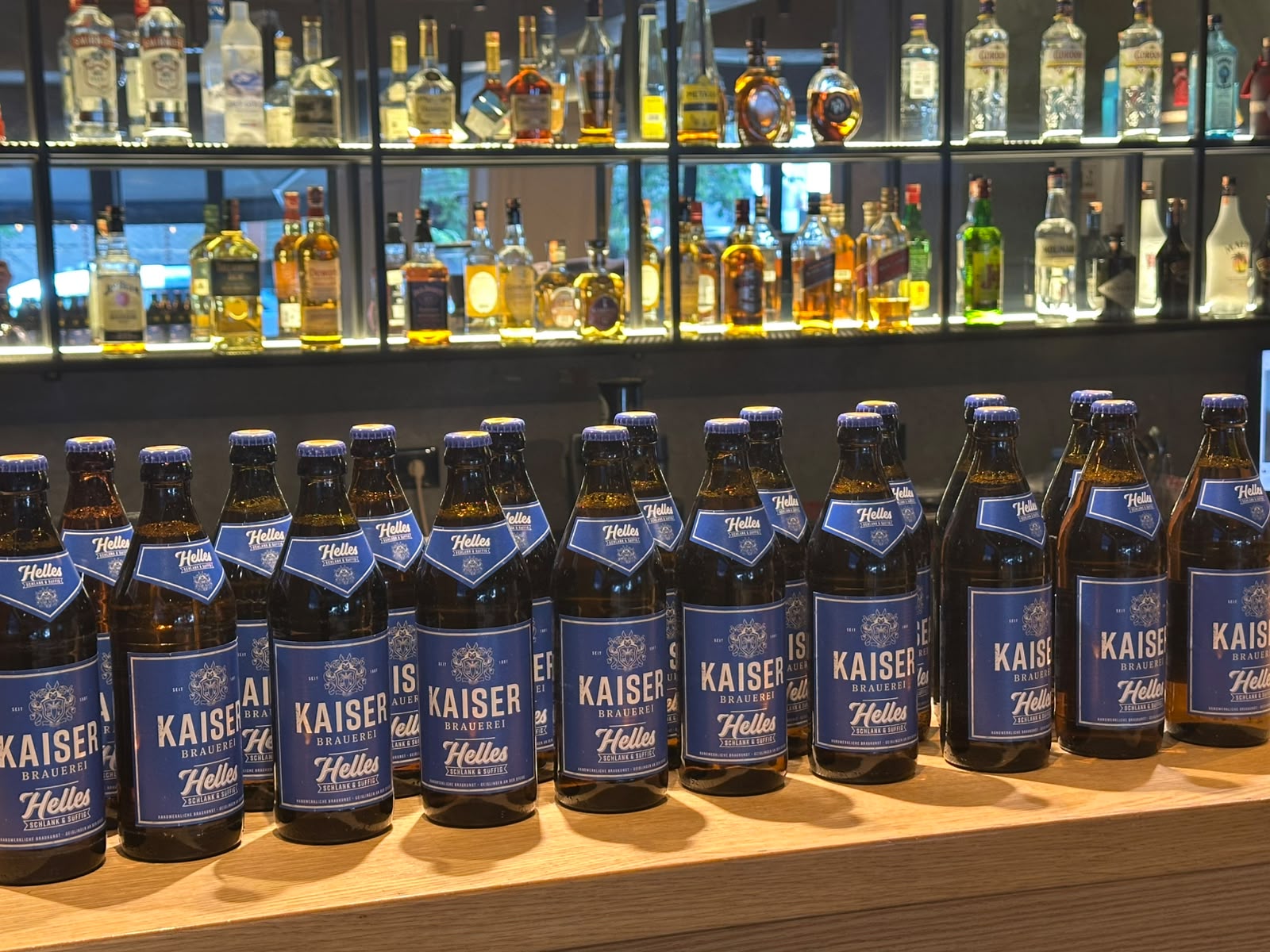 A row of cold Kaiser Helles beers along the bar